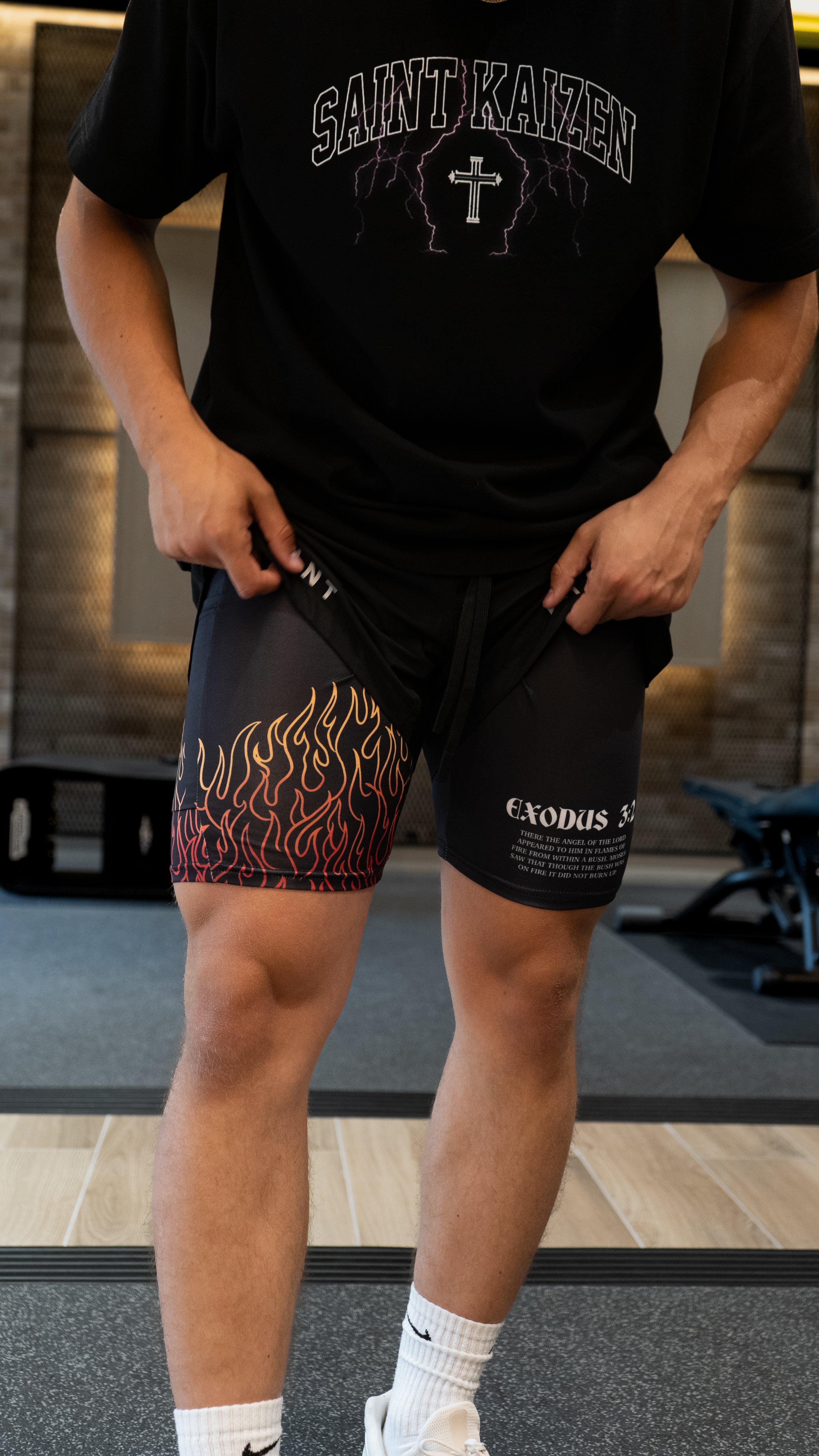 Christian-themed performance shorts with Bible verses, made from a blend of cotton and polyester with a spandex inner lining, featuring Saint Kaizen screen print and multiple pockets for convenience.