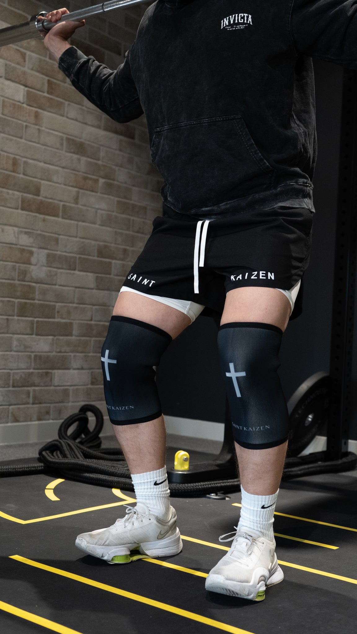 Christian-themed Cross Knee Sleeves with 7mm thickness, offering support and compression for workouts, featuring a durable design for heavy lifting.