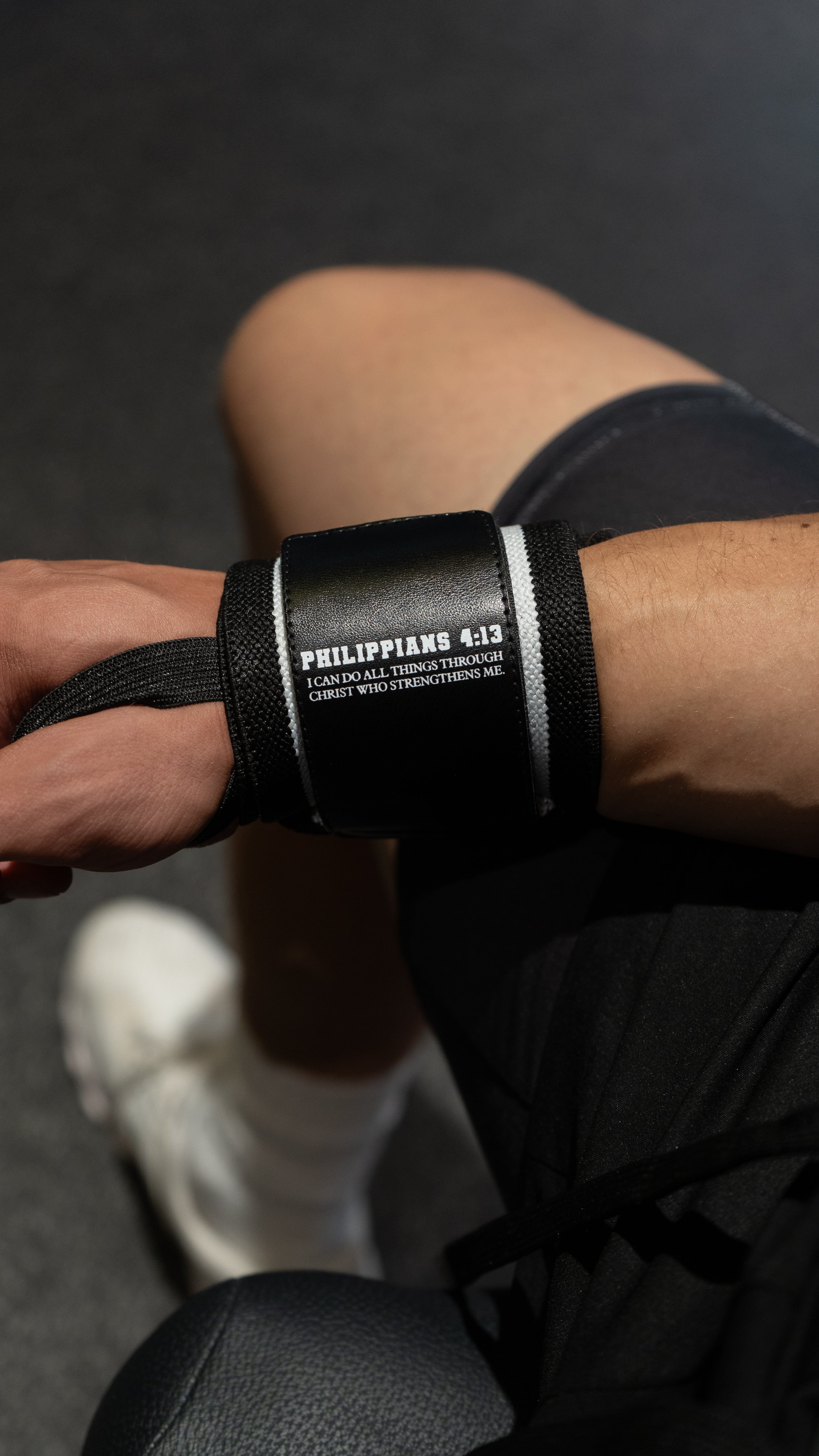 Christian-themed ultra-supportive and comfortable wrist wraps with a sleek design and leather Saint Kaizen badge. Sold as a pair. Perfect for weight training.