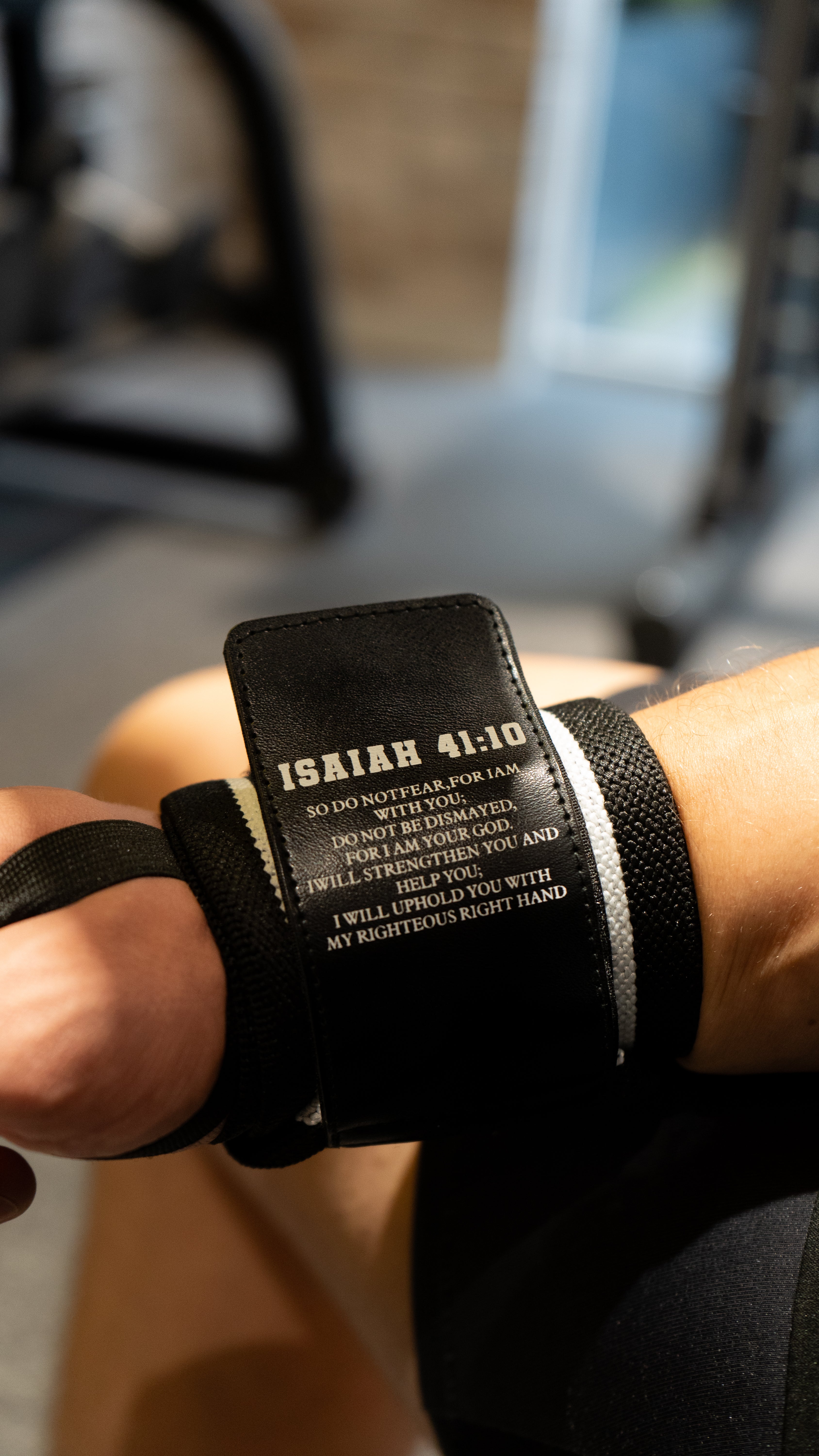 Christian-themed ultra-supportive and comfortable wrist wraps with a sleek design and leather Saint Kaizen badge. Sold as a pair. Perfect for weight training.