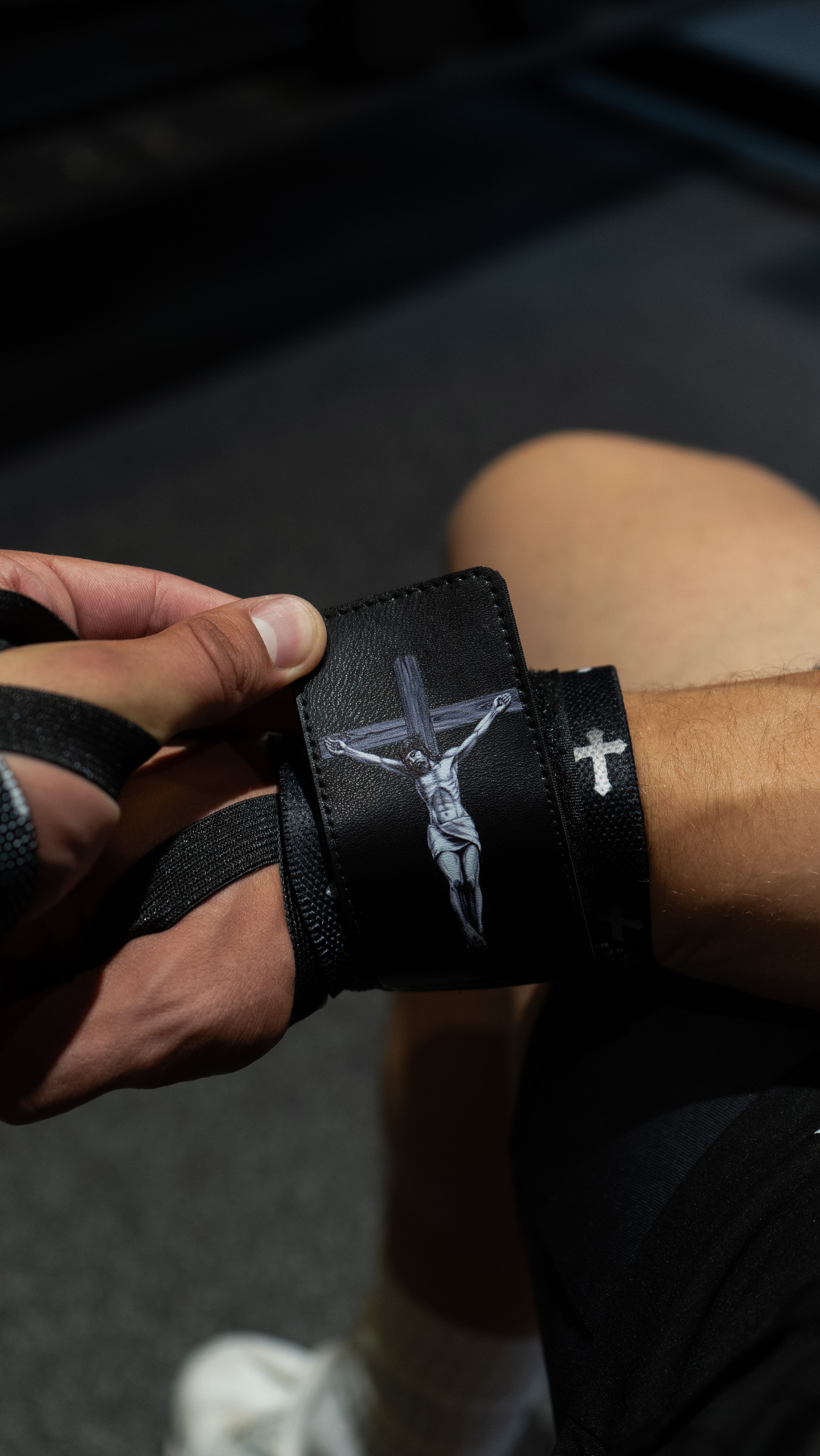 Christian-themed ultra-supportive and comfortable wrist wraps with a sleek design and leather Saint Kaizen badge. Sold as a pair. Perfect for weight training.