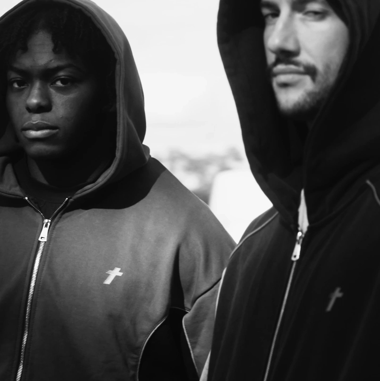 Two models wearing the Philippians 4:13 zip-up hoodies
