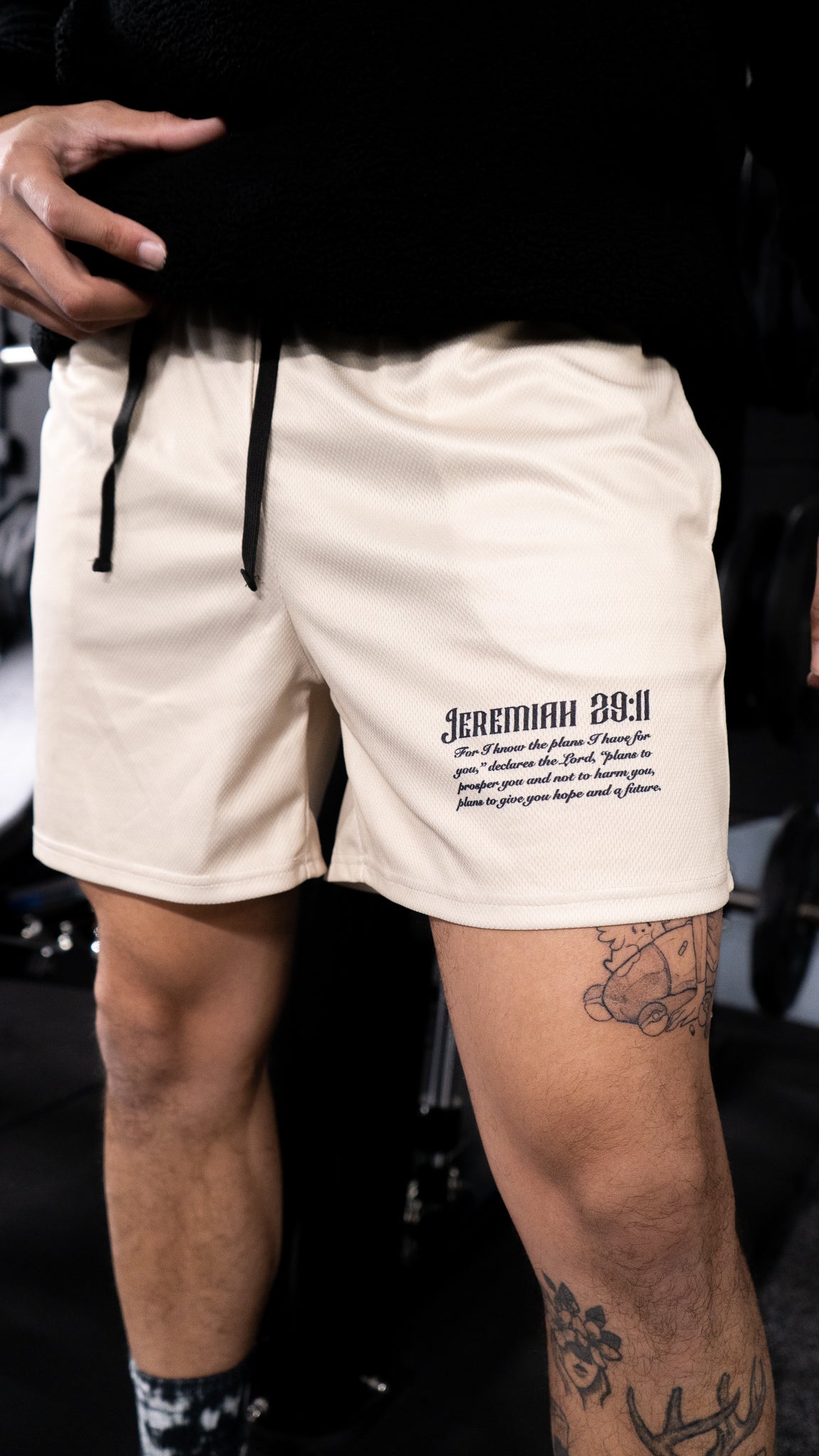 Christian-themed mesh gym shorts with Bible verses, made from 100% polyester, featuring double side pockets and a 5-inch inseam for comfort and mobility.