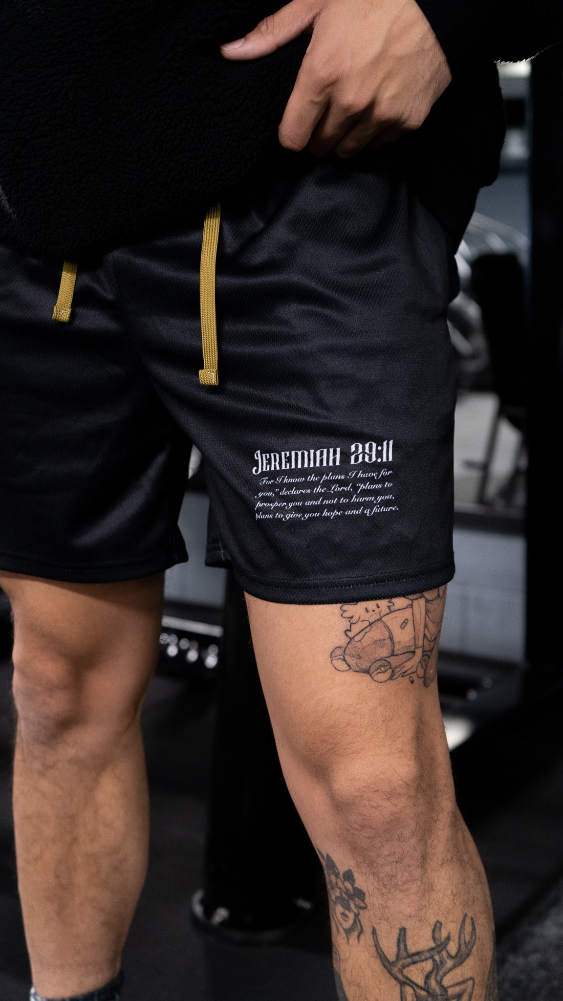 Christian-themed mesh gym shorts with Bible verses, made from 100% polyester, featuring double side pockets and a 5-inch inseam for comfort and mobility.