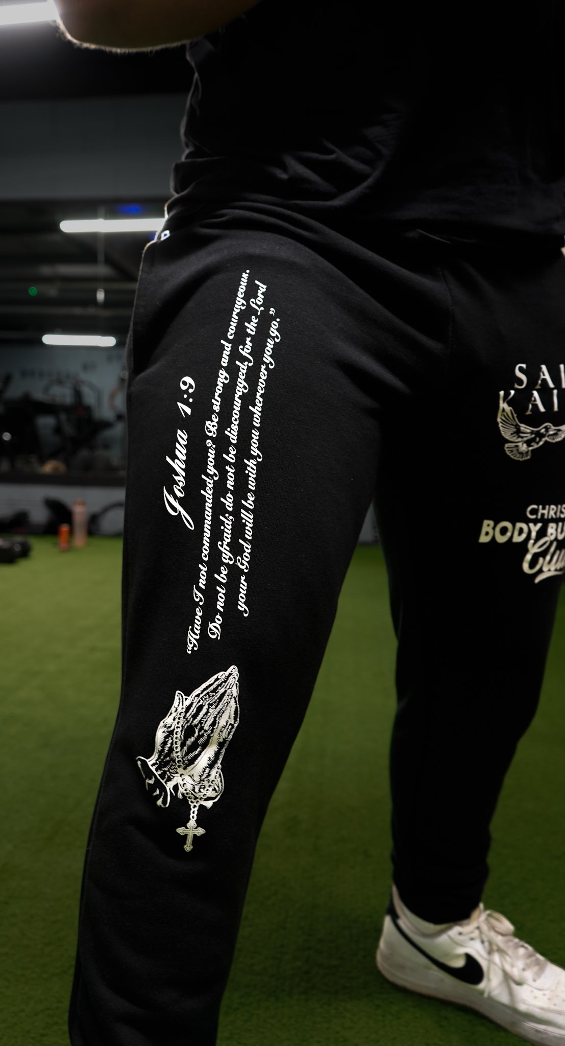 Christian-themed Joggers from Gym Wear, featuring inner drawstrings, premium screenprint, and a terry fleece interior made from 70% cotton, 27% polyester, and 3% spandex for comfort and style.