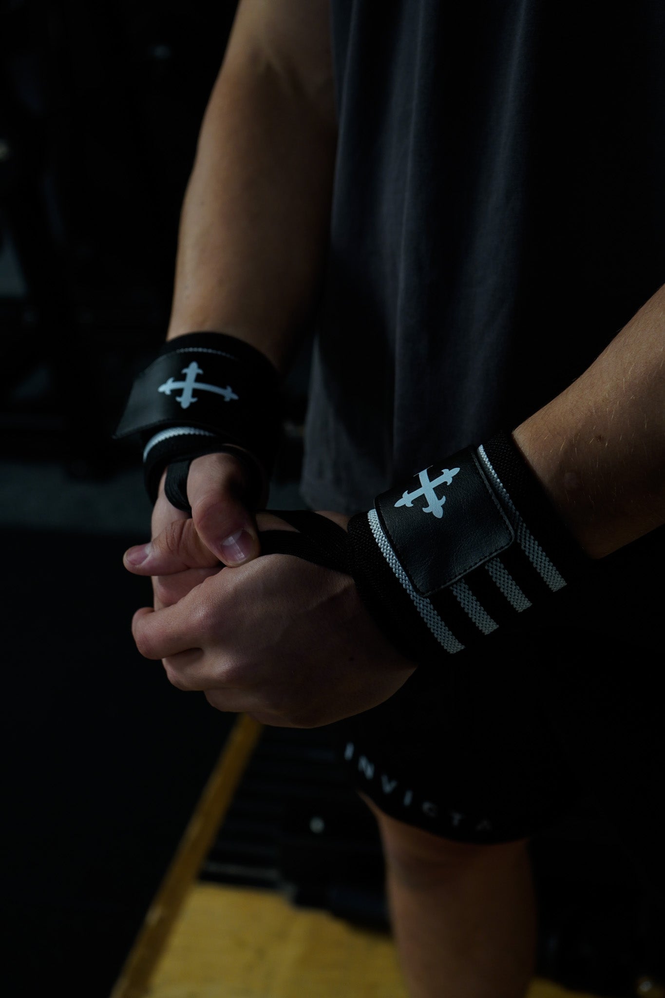 Christian-themed ultra-supportive and comfortable wrist wraps with a sleek design and leather Saint Kaizen badge. Sold as a pair. Perfect for weight training.