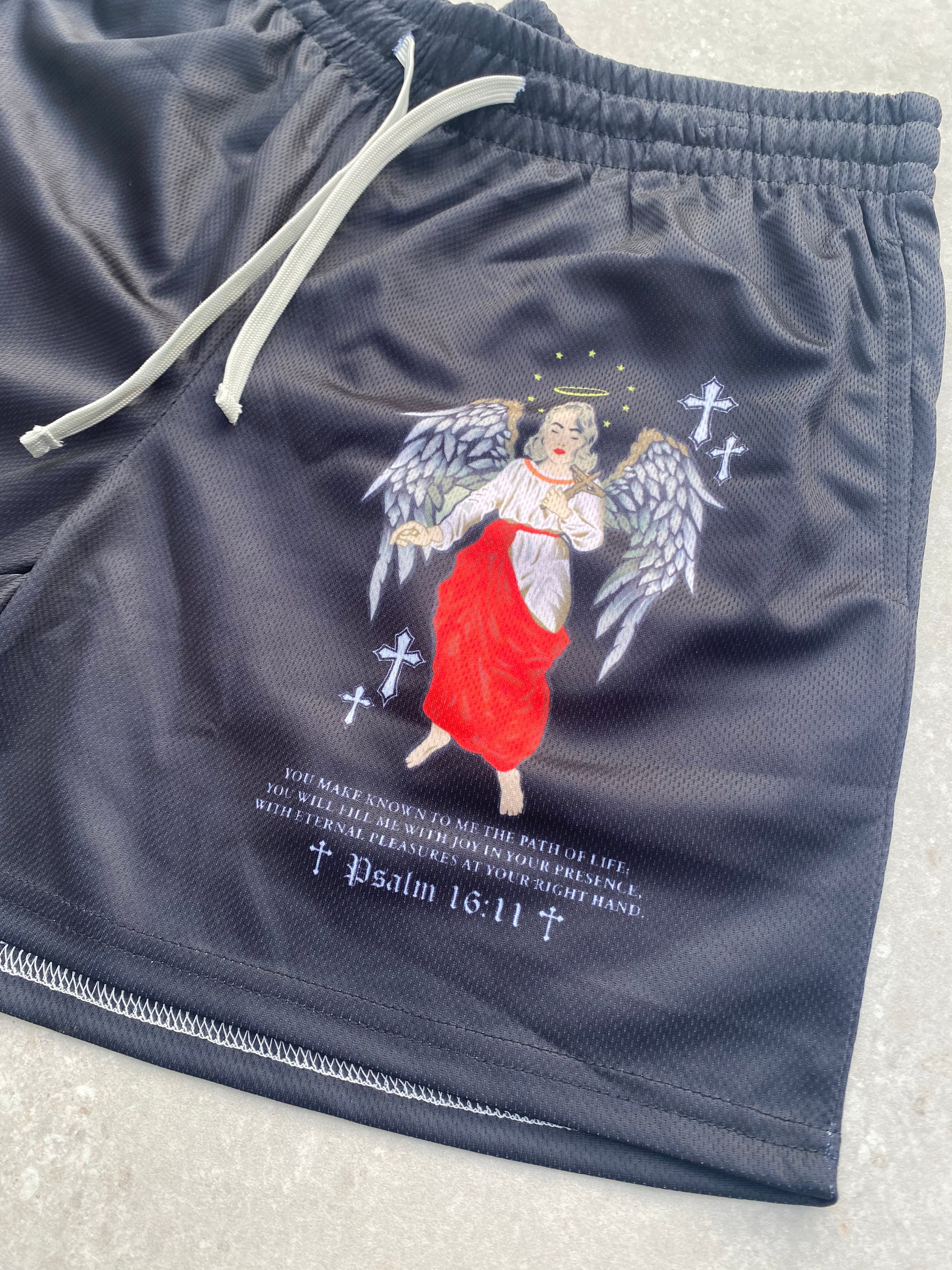 Christian-themed mesh gym shorts with Bible verses, made from 100% polyester, featuring double side pockets and a 5-inch inseam for comfort and mobility.