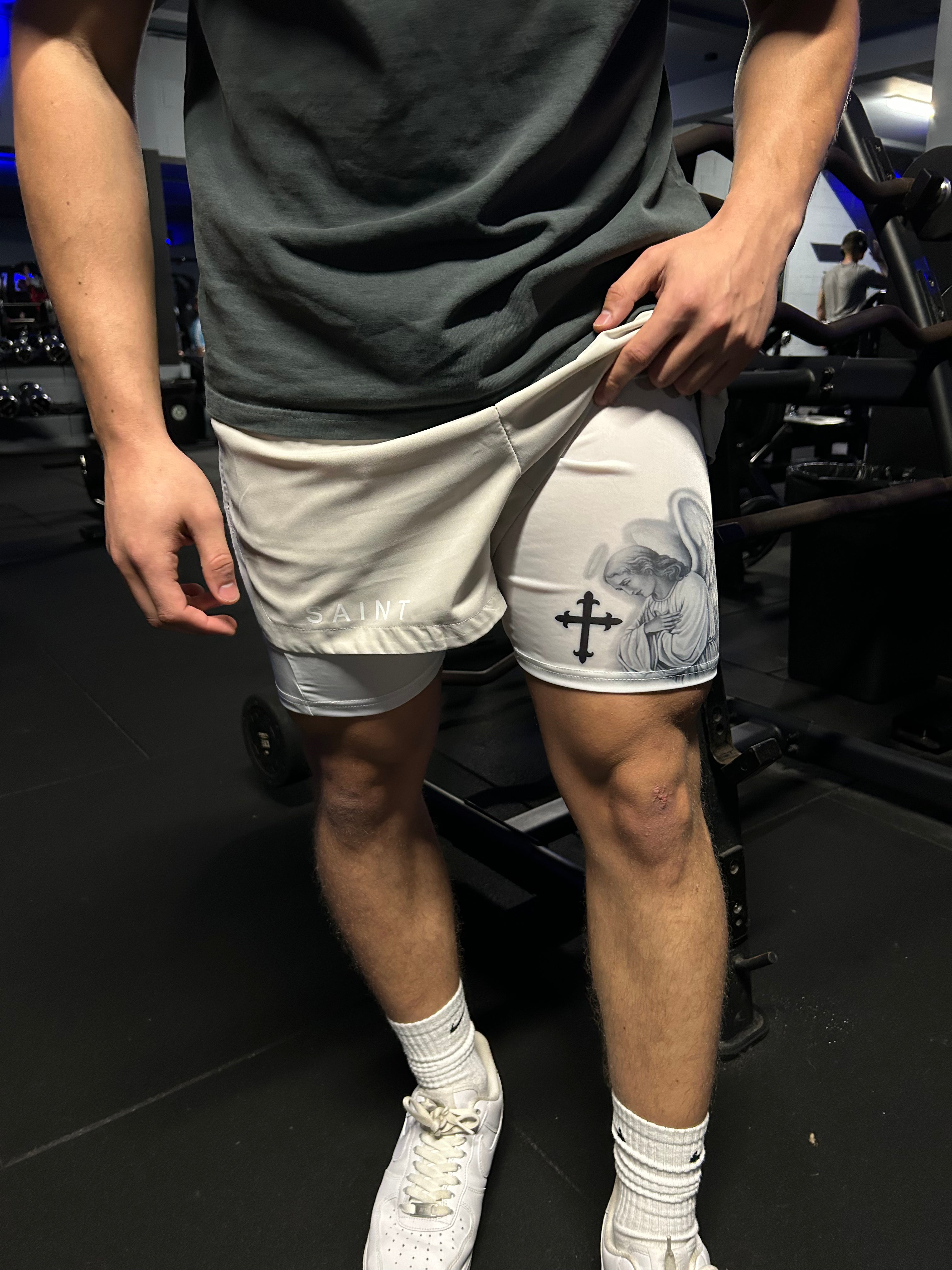 Christian-themed performance shorts with Bible verses, made from a blend of cotton and polyester with a spandex inner lining, featuring Saint Kaizen screen print and multiple pockets for convenience.