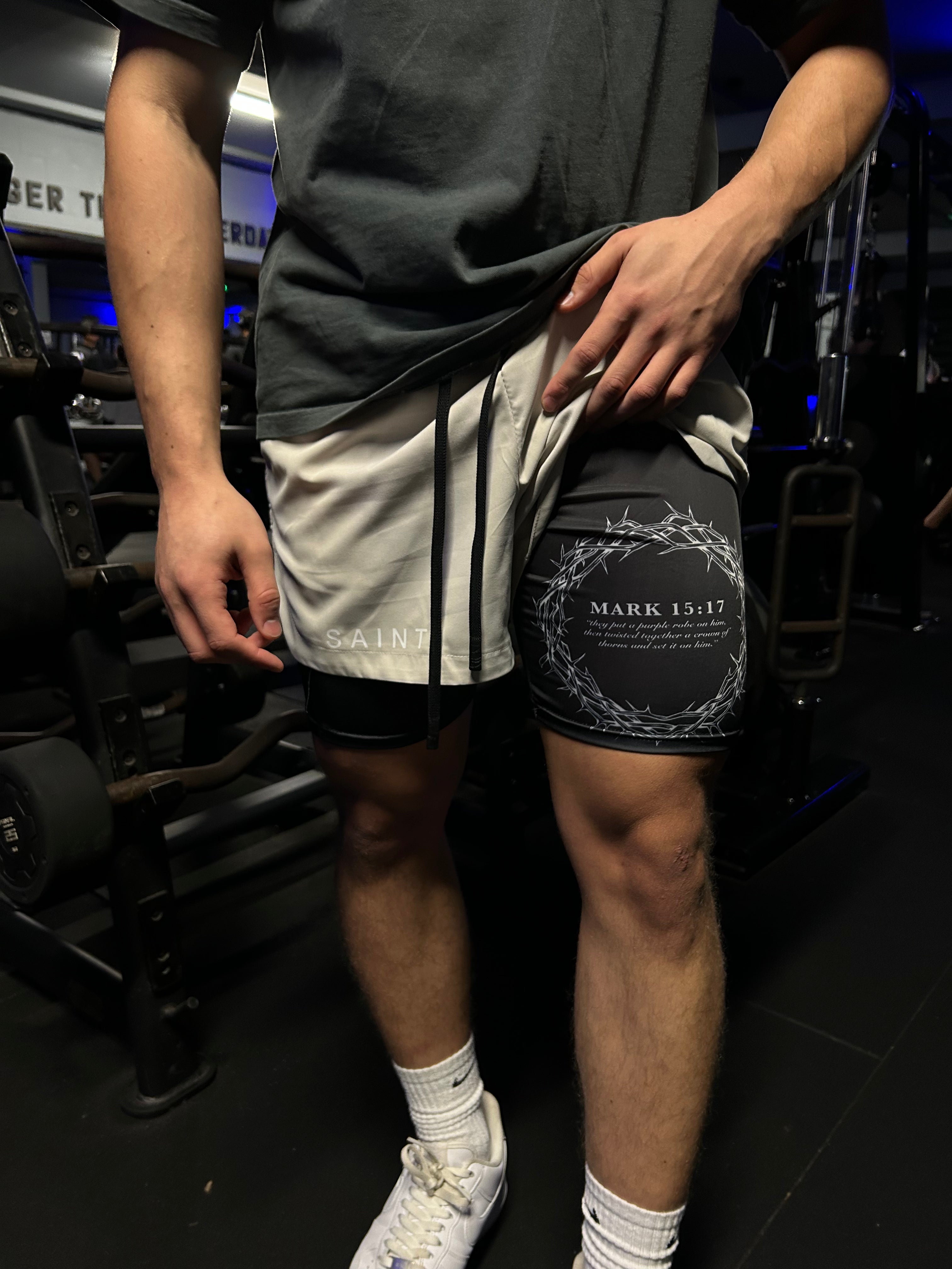 Christian-themed performance shorts with Bible verses, made from a blend of cotton and polyester with a spandex inner lining, featuring Saint Kaizen screen print and multiple pockets for convenience.