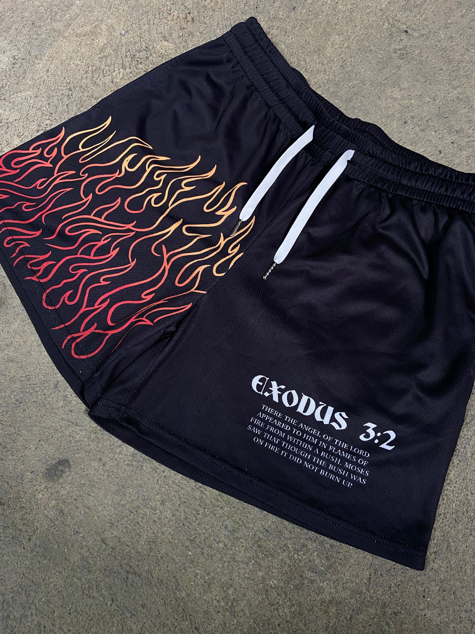 Christian-themed mesh gym shorts with Bible verses, made from 100% polyester, featuring double side pockets and a 5-inch inseam for comfort and mobility.