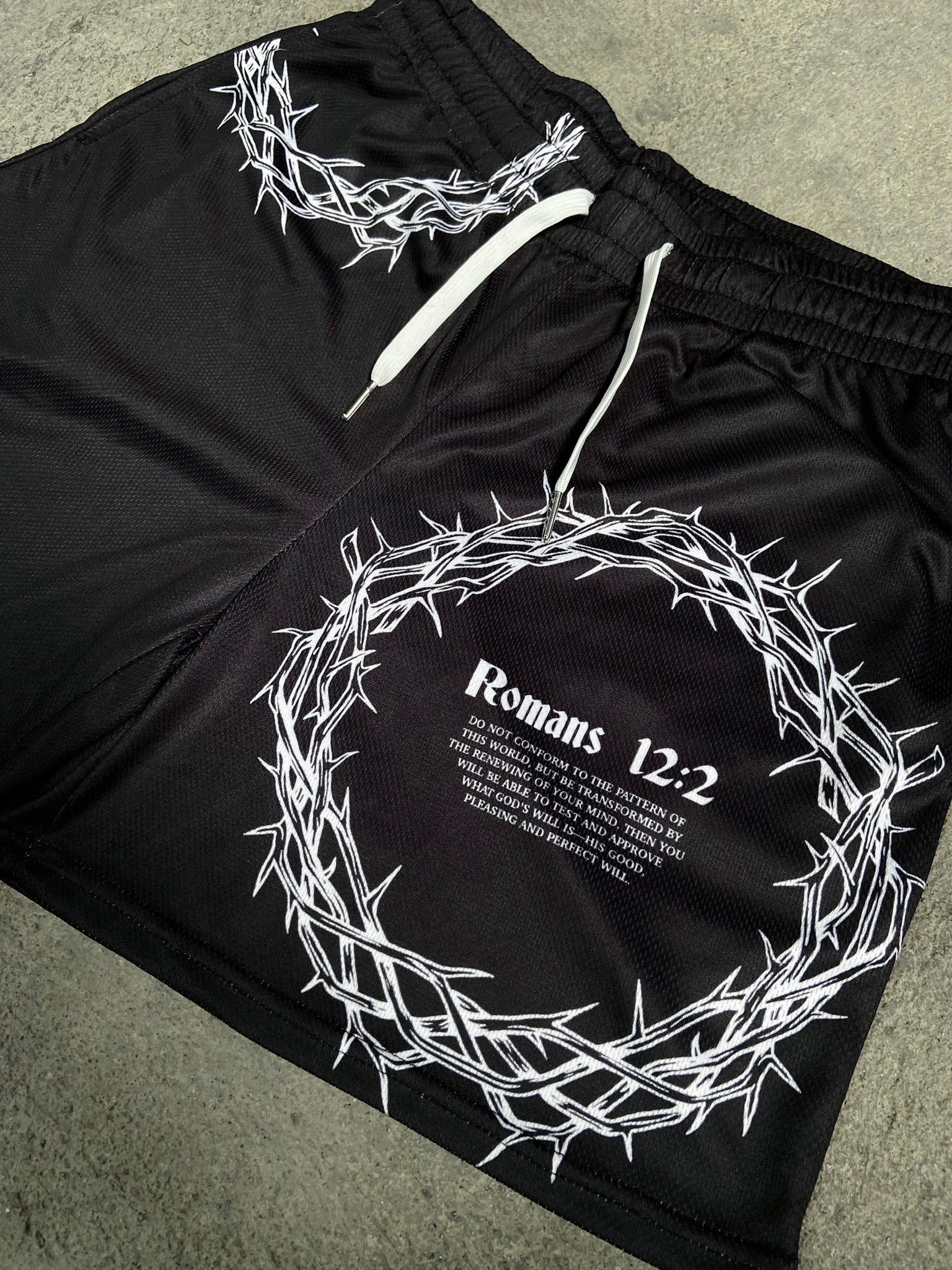 Christian-themed mesh gym shorts with Bible verses, made from 100% polyester, featuring double side pockets and a 5-inch inseam for comfort and mobility.